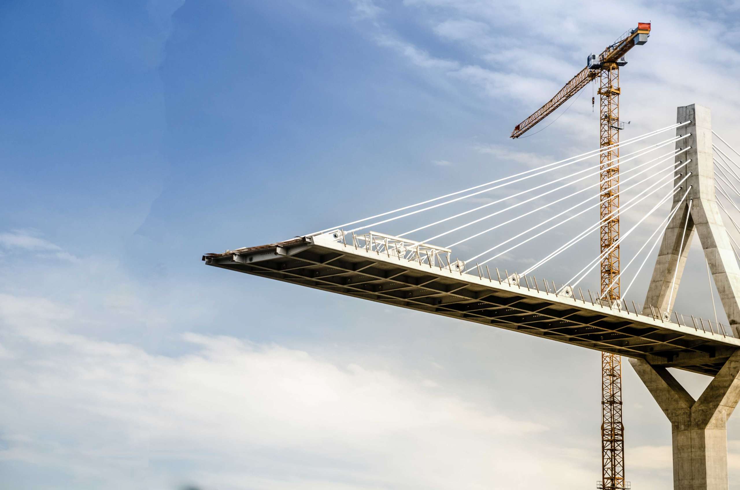 Bridge under construction with a crane